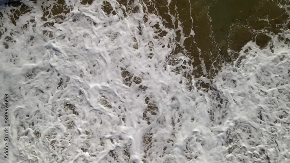 Top view of foam waves break Top view of foam waves break