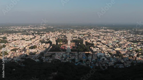 Top Aerial View Of Tiruvannamalai Shiva Temple In India during beautiful lighting day.Slow forward shot. photo