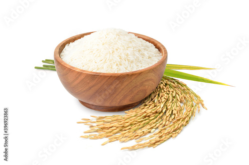 White jasmine rice in wooden bowl with paddy rice isolated on white background.