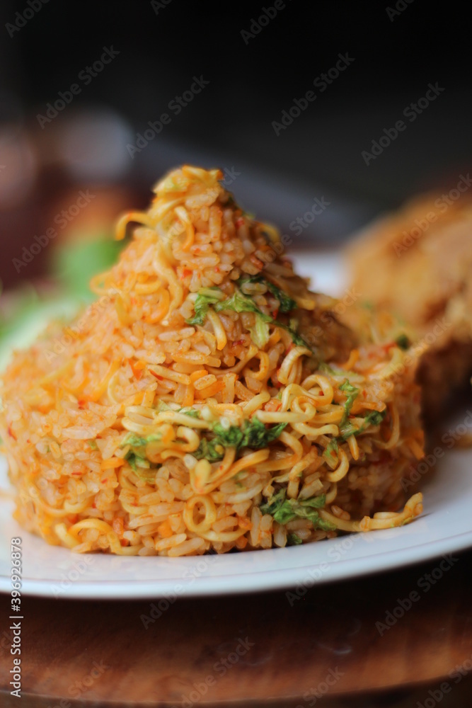 Indonesia Traditional Spicy Fried Rice with fried chicken Indonesia Traditional Spicy Fried Rice with fried chicken
