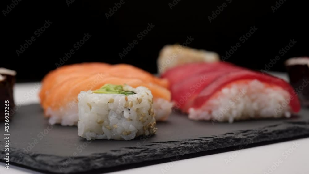 Sushi assortment Asian Japanese food with nigiri salmon, nigiri tuna, hosomaki, uramaki Sushi assortment Asian Japanese food with nigiri salmon, nigiri tuna, hosomaki, uramaki