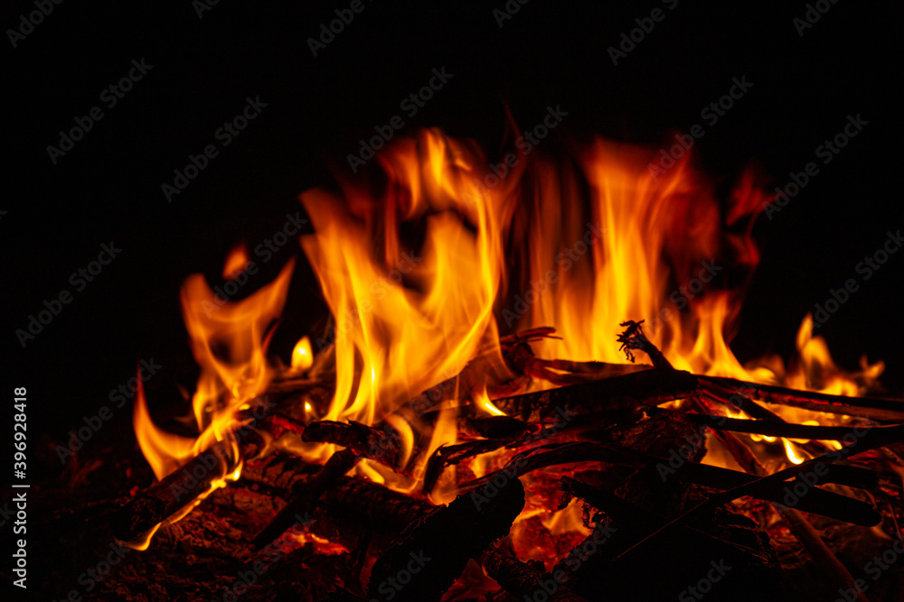 Campfire close up at night with black background. Fire heat adventure camping concept Campfire close up at night with black background. Fire heat adventure camping concept
