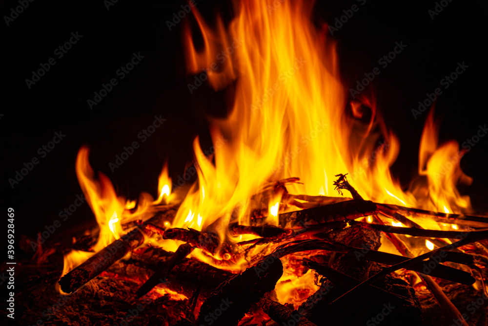 Campfire close up at night with black background. Fire heat adventure camping concept Campfire close up at night with black background. Fire heat adventure camping concept