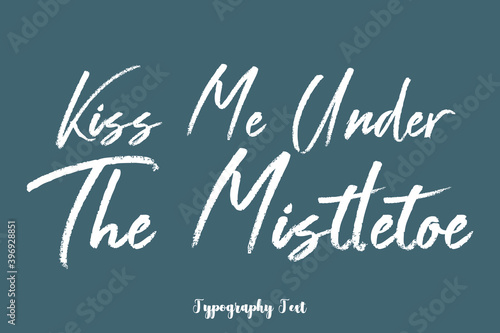 Kiss Me Under The Mistletoe Handwriting Text Phrase On Dork Gray Background