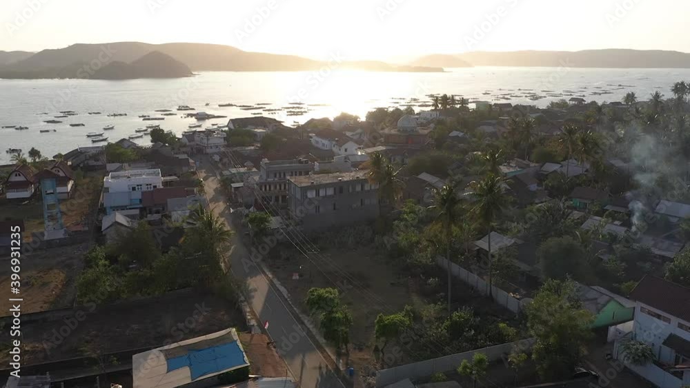 Radiant Sunrise Over The Village Of Gerupuk In Lombok Island, Indonesia - aerial drone Radiant Sunrise Over The Village Of Gerupuk In Lombok Island, Indonesia - aerial drone