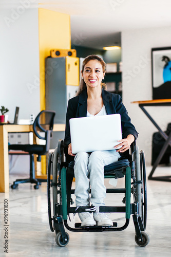 фотографія Mexican woman in wheelchair at workplace in Mexico city