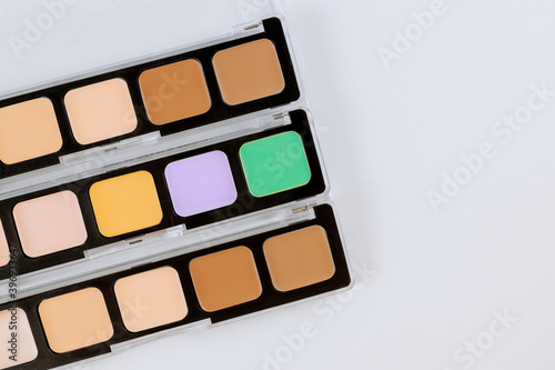 Set of eyeshadows in pastel beige colors pallet brown matte shadows  closeup of makeup product on an isolated white background