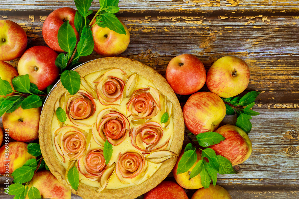 Cheesecake with rose shape apple decorated and fresh apples. Cheesecake with rose shape apple decorated and fresh apples.
