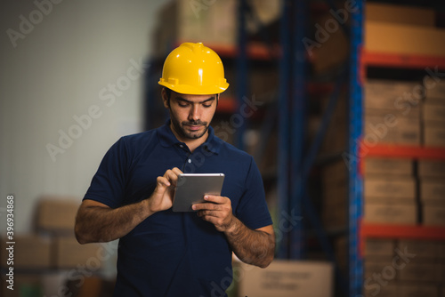 Man warehouse worker with a...