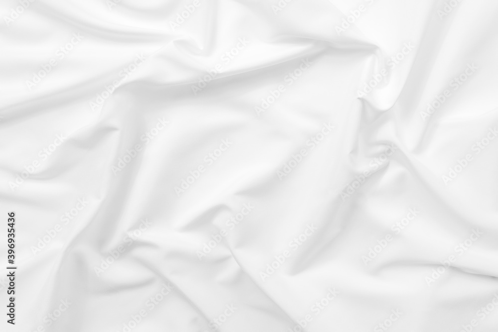 Abstract white fabric texture background. Cloth soft wave. Creases of satin. silk and cotton.