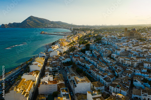 Panoramic aerial view of Altea city by Mediterranean coast overlooking blue and white domes of Church of Our Lady of Solace, Spain..