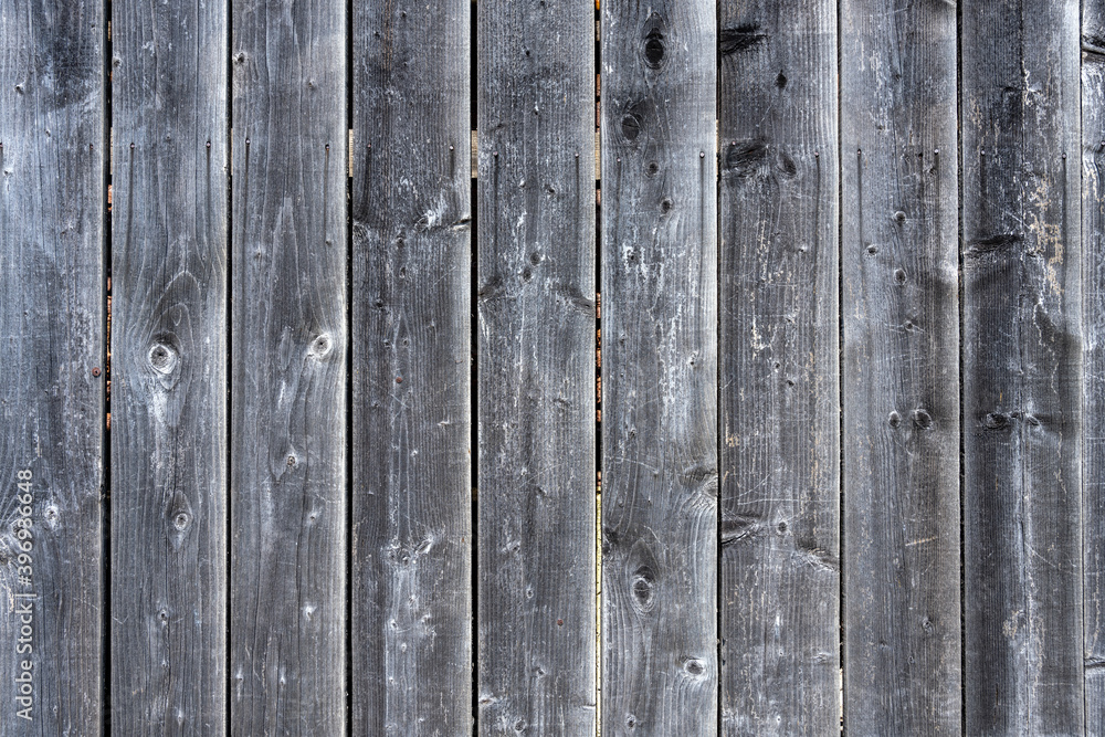 Background from an old and worn plank wall Background from an old and worn plank wall
