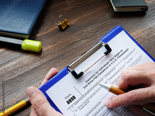 Business concept meaning Form 8898 Statement for Individuals Who Begin or End Bona Fide Residence in a U.S. Possession with inscription on the sheet.