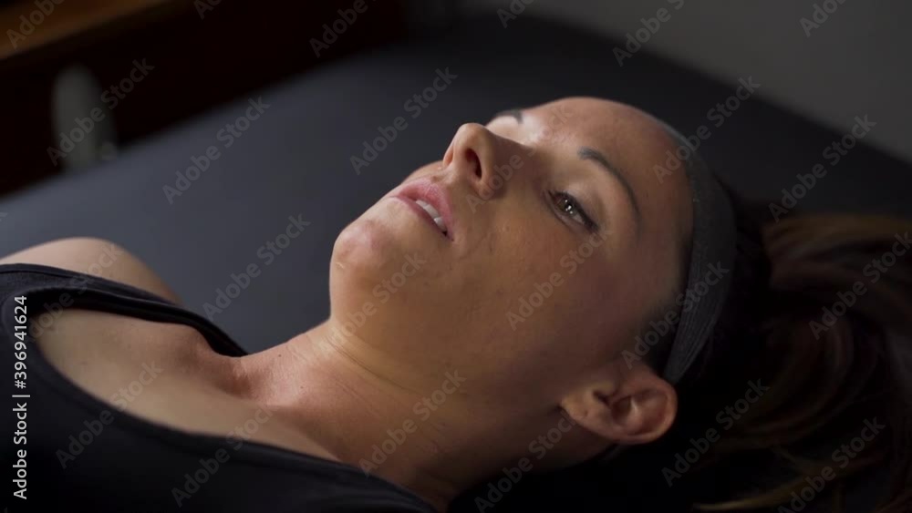 Athlete laying on physio table for examination Athlete laying on physio table for examination