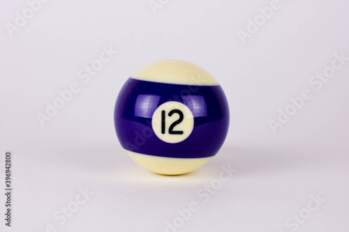 Shiny dark blue white ball number 12 for billiard isolated on white background