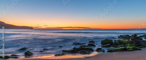 Sunrise Panorama by the Sea with Green Mossy Rocks