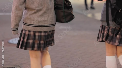 渋谷センター街を歩く制服の女子高生の後ろ姿 photo