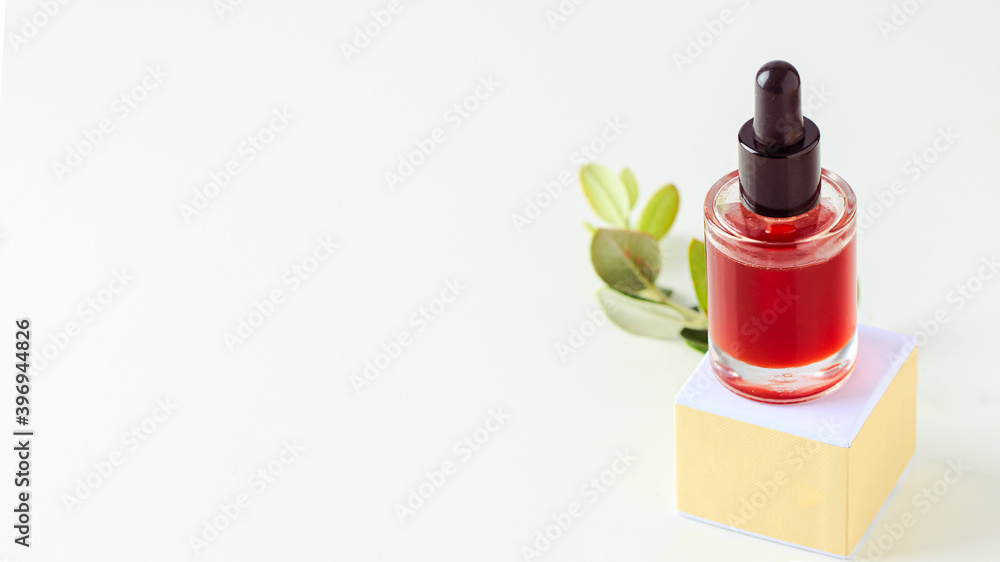 Obraz premium Natural serum with essential oil and vitamins on white large background for banner. natural cosmetic concept.