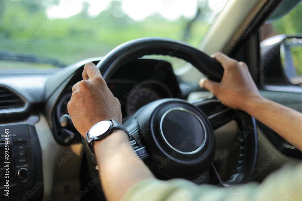 Portrait of young Indian business man, driving a car Portrait of young Indian business man, driving a car