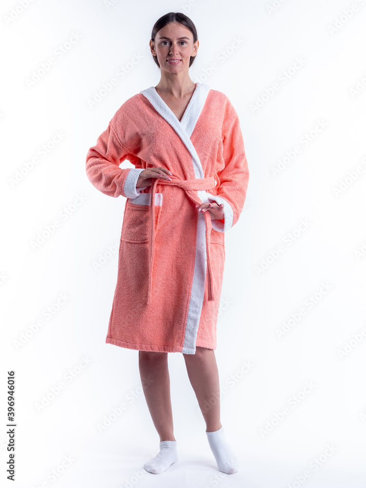 woman in a Bathrobe on an isolated white background with a smile on her face. woman in a Bathrobe on an isolated white background with a smile on her face.