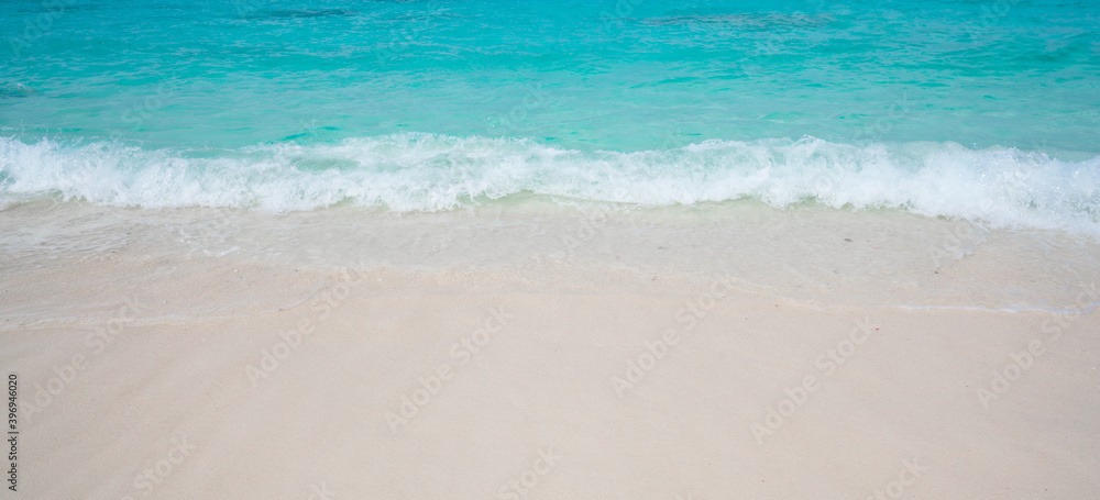 Beach with white sand and soft blue ocean wave