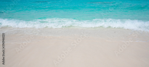 Beach with white sand and soft blue ocean wave