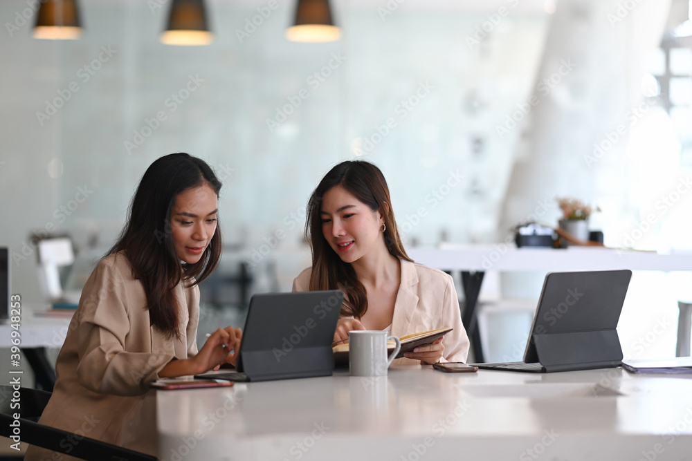 Businesspeople collaborating and talking through new ideas in meeting room. Businesspeople collaborating and talking through new ideas in meeting room.