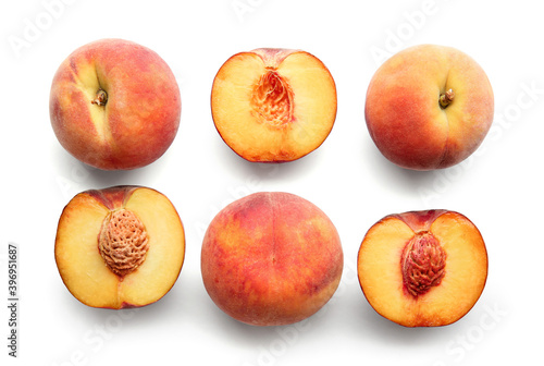 Sweet ripe peaches on white background