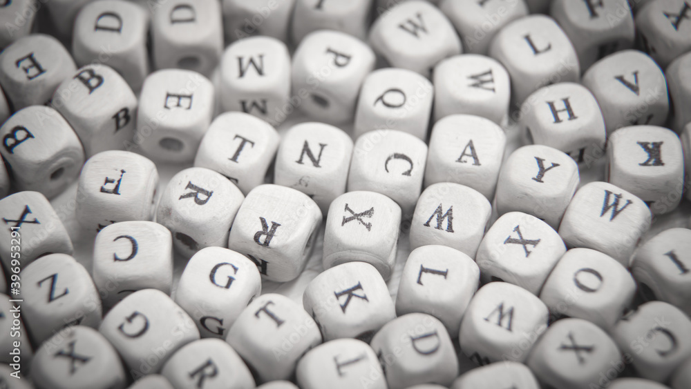 Wooden small cubes with letters.