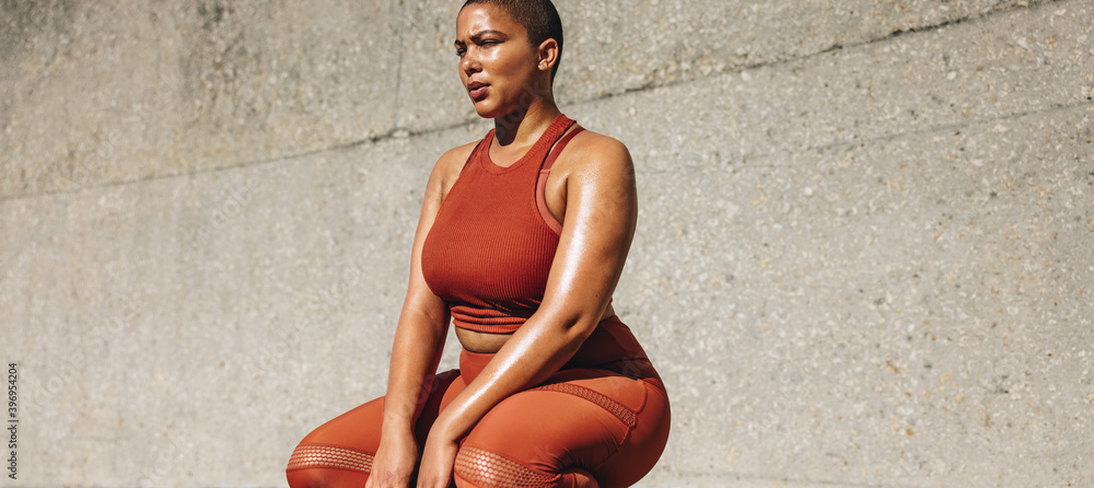 © Jacob Lund - Plus size female model taking a break from exercise © Jacob Lund - Plus size female model taking a break from exercise