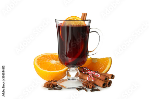 Glass of mulled wine and ingredients isolated on white background