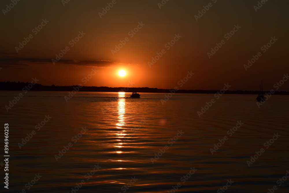 beautiful and sunny sunset on the lake