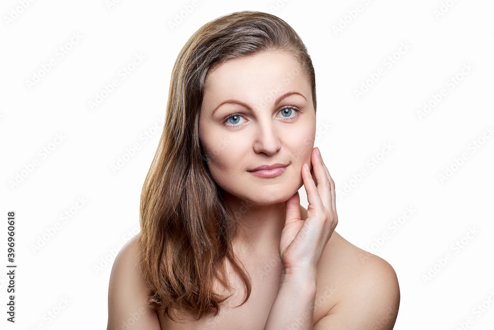Portrait of pretty smiling woman with nude makeup and hand on chin isolated on white background, copy space. Girl with clean healthy skin, beauty model.