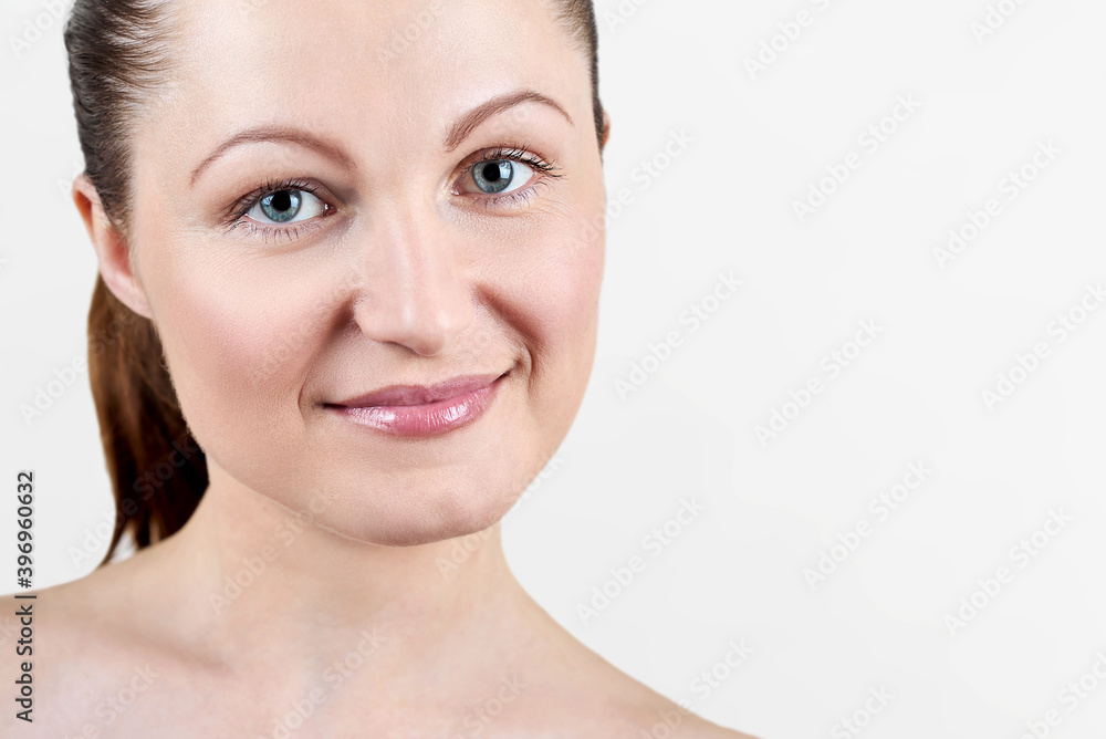 Portrait of pretty smiling woman with nude make up isolated on white background, copy space. Girl with clean healthy skin, beauty model. Portrait of pretty smiling woman with nude make up isolated on white background, copy space. Girl with clean healthy skin, beauty model.