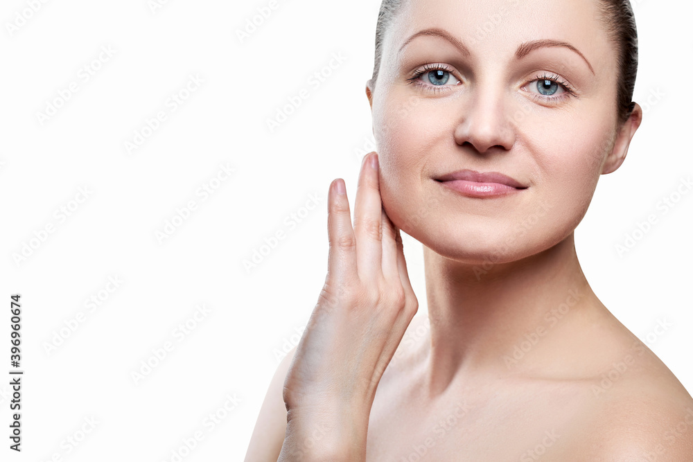 Portrait of pretty smiling woman with nude makeup and hand on chin isolated on white background, copy space. Girl with clean healthy skin, beauty model. Portrait of pretty smiling woman with nude makeup and hand on chin isolated on white background, copy space. Girl with clean healthy skin, beauty model.