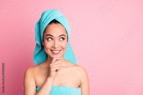 Photo of young girl happy positive smile think curious look empty space dream spa treatment isolated over pastel color background