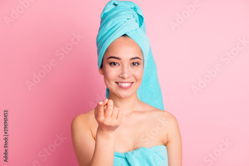 Photo of young asian woman happy positive smile show index finger daily contact lens isolated over pastel color background
