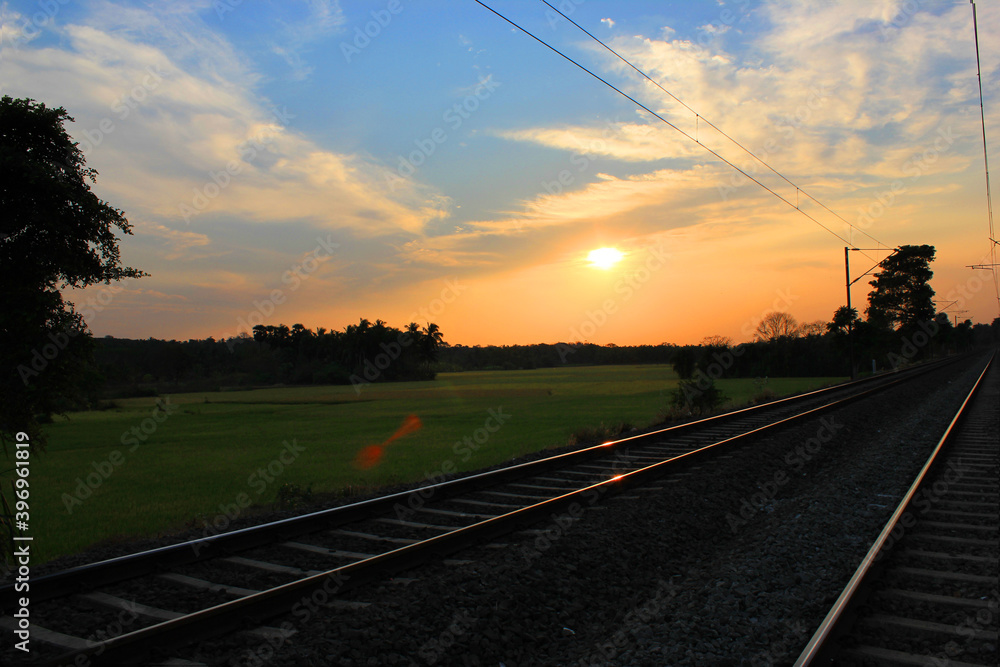 Beautiful sunset view of landscape with rail track