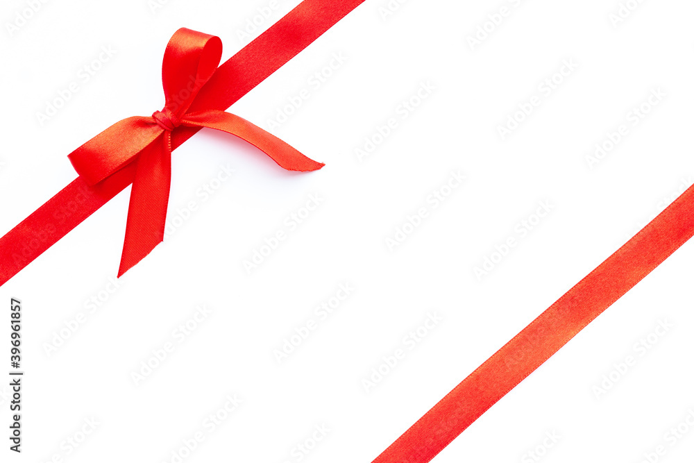 Red ribbon with bow isolated on white. Top view. Copy space Red ribbon with bow isolated on white. Top view. Copy space