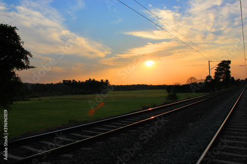 Beautiful sunset view of landscape with rail track