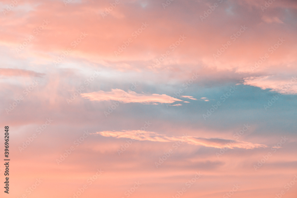 beautiful winter sunrise cloudscape with blue pink and orange colors