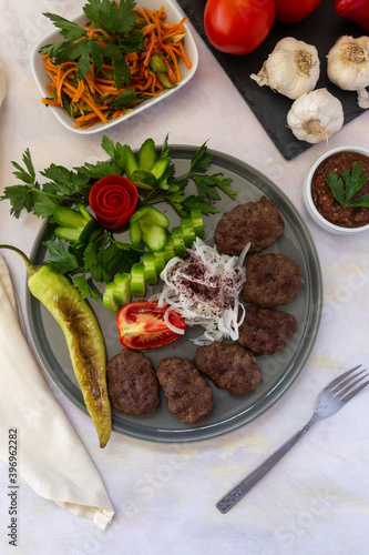 Delicious Turkish traditional kebab meatballs on white background. Turkish Food Kofte or Kofta (meatball).