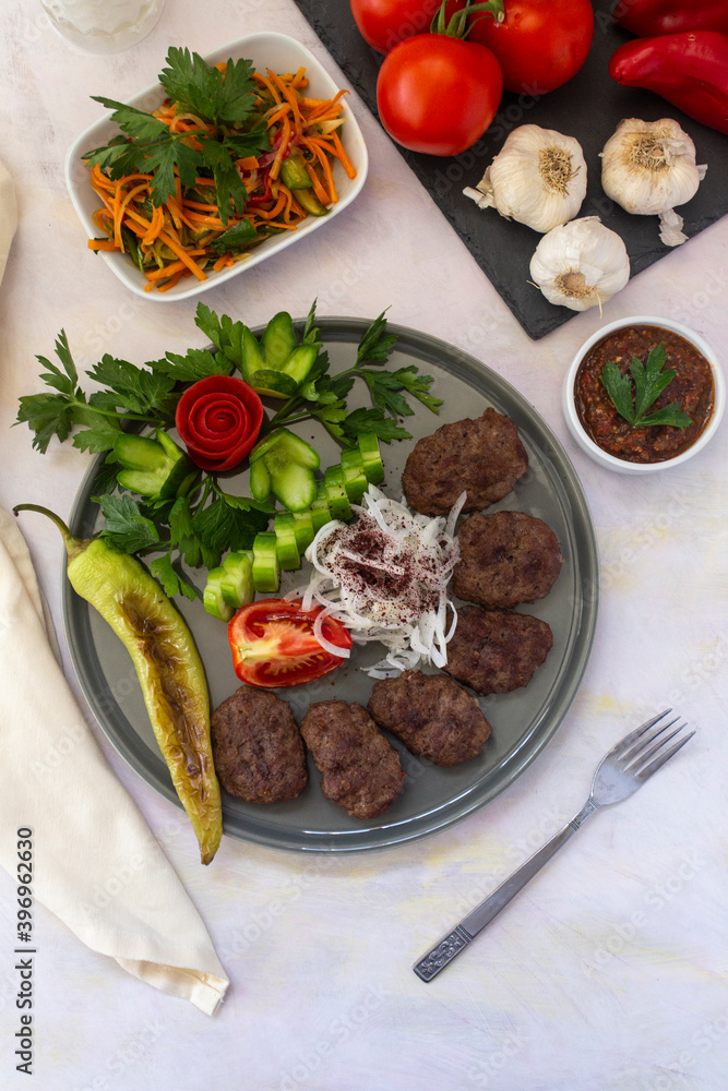 Delicious Turkish traditional kebab meatballs on white background. Turkish Food Kofte or Kofta (meatball).