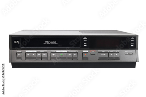 Old videocassette recorder 1980s-1990s with videotape isolated on white background. foreground