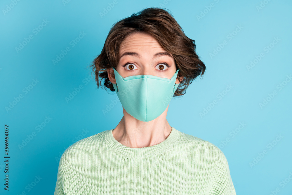 Photo of impressed short hairdo girl wear face mask lime sweater isolated on teal color background Photo of impressed short hairdo girl wear face mask lime sweater isolated on teal color background