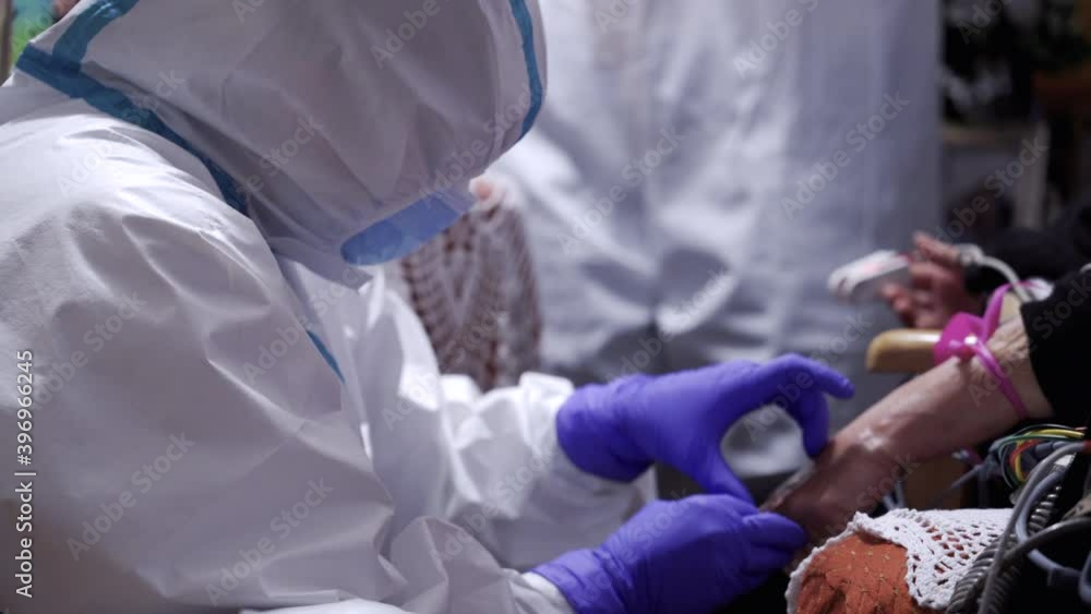 Emergency nurse or paramedic wearing personal protective equipment ppe