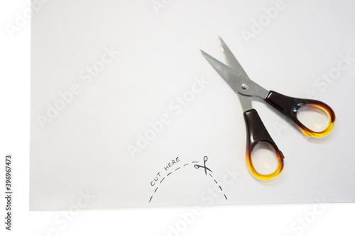 Scissor kept on paper with instructions written on paper