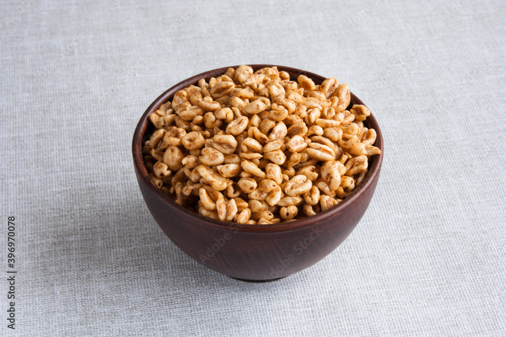 delicious airy wheat in honey glaze in a clay bowl delicious airy wheat in honey glaze in a clay bowl