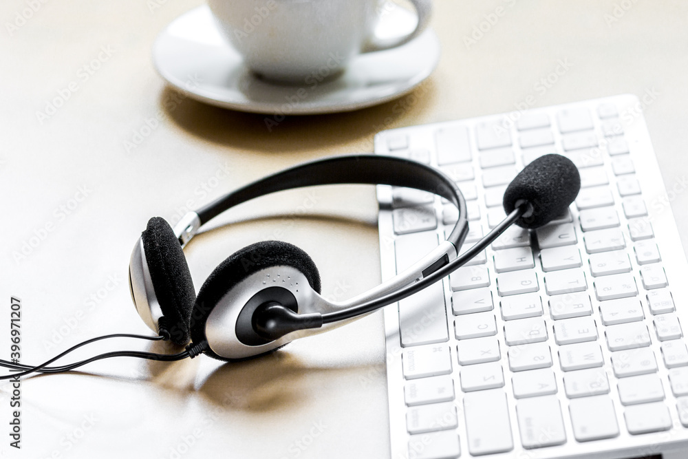 call center manager work desk with headset and cup call center manager work desk with headset and cup