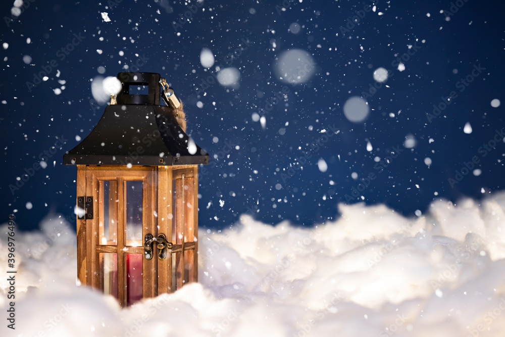 Magical Lantern On Snow With Christmas Decoration and holiday lights.